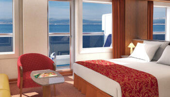 1648730556.4567_c150_Carnival Cruise Lines Carnival Conquest Accommodation Ocean Suite.jpg